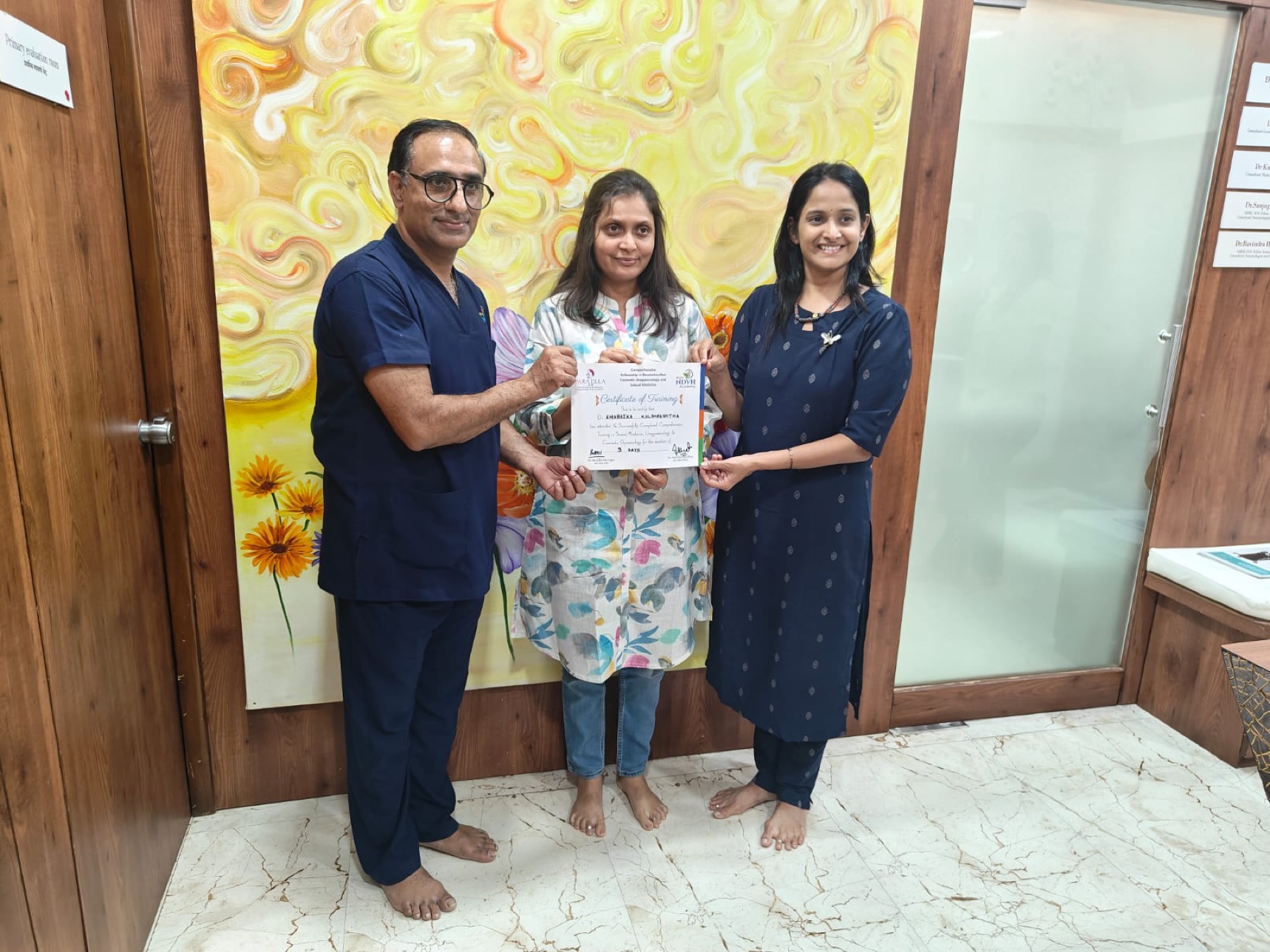 Dr. Shabdika receiving a certificate of advanced training